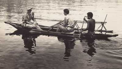 three men in outrigger