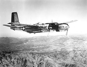 Douglas A-26C, in flight over mountains