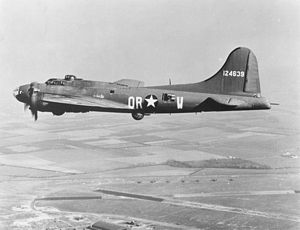 Boeing B-17 flying over airfield