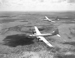 two B-29s In Flight over desert
