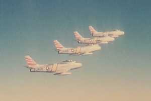 Four F-86 Sabres flying in formation
